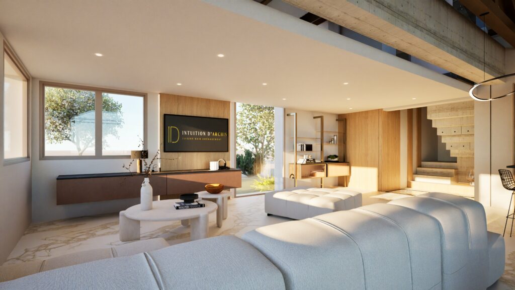 Le salon moderne avec ses grandes fenêtres, ses touches de bois clair et ses meubles neutres témoigne d'un aménagement intérieur bien pensé ; une télévision murale et des vues sur la cuisine complètent cet espace ouvert et baigné de soleil.